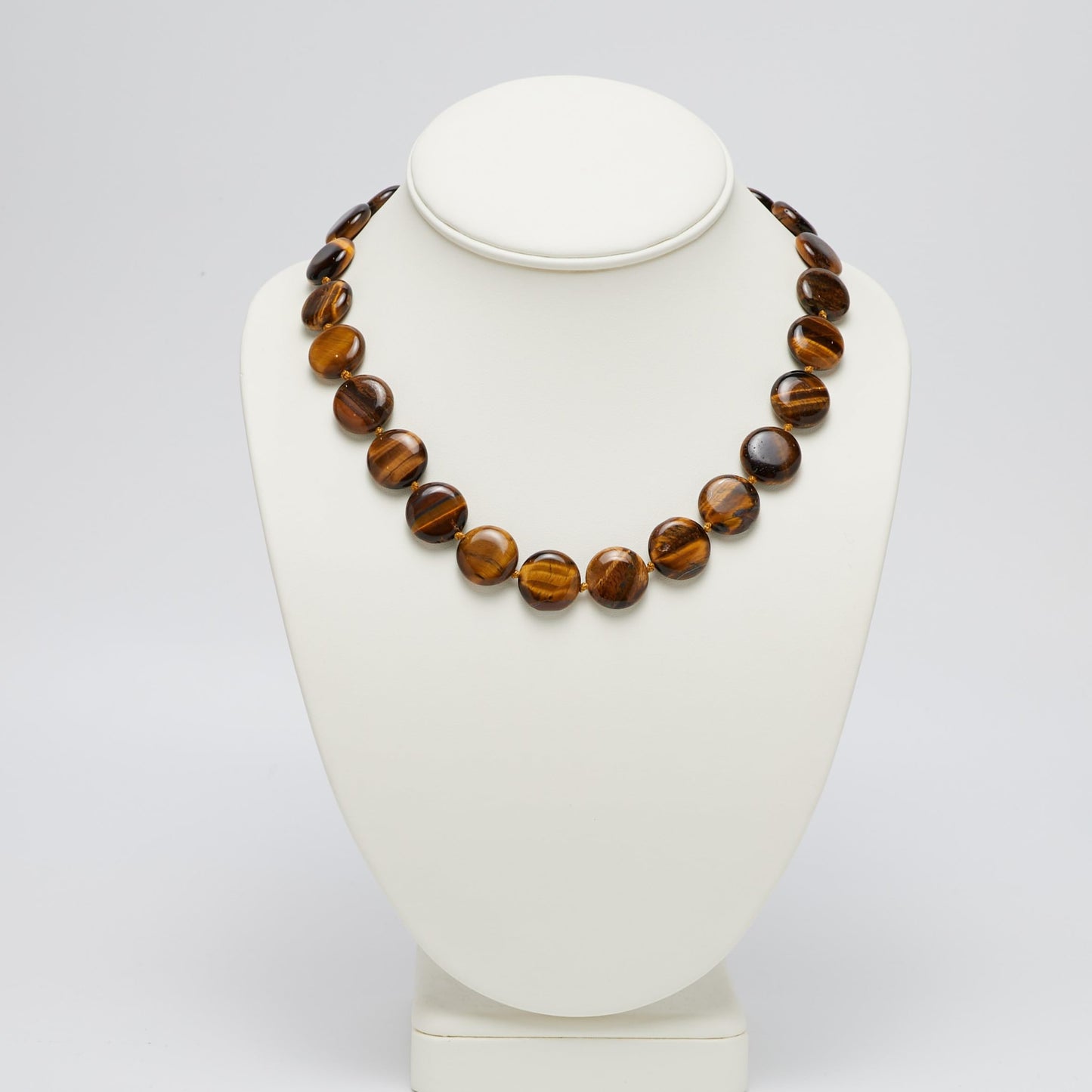 Round Disc Tiger's Eye Gemstone Necklace Displayed on Necklace Stand