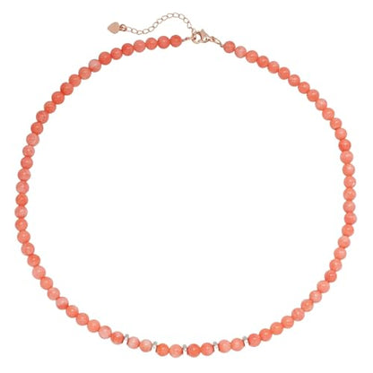 Pink Coral Beaded Gemstone Necklace Against a White Background