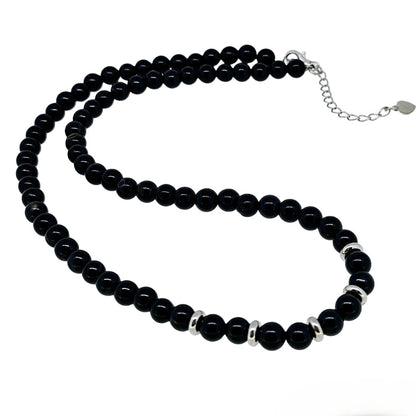 Round Black Agate Beaded Gemstone Necklace Against a White Background