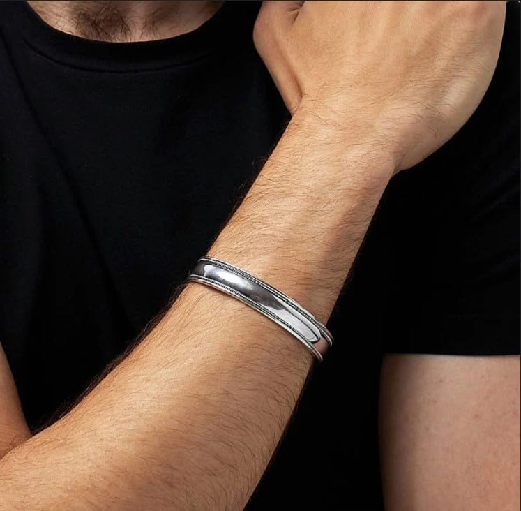 925 sterling silver polished bangle with braided details on model