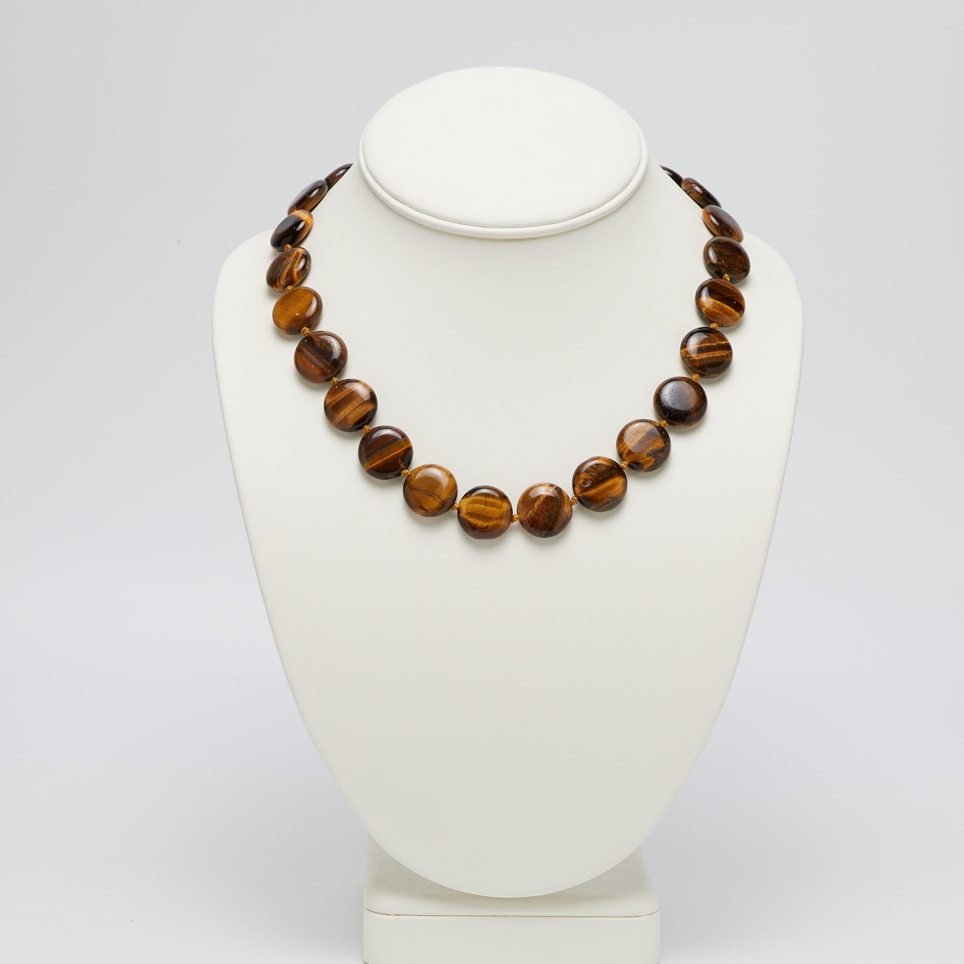 Round Disc Tiger's Eye Gemstone Necklace Displayed on Necklace Stand