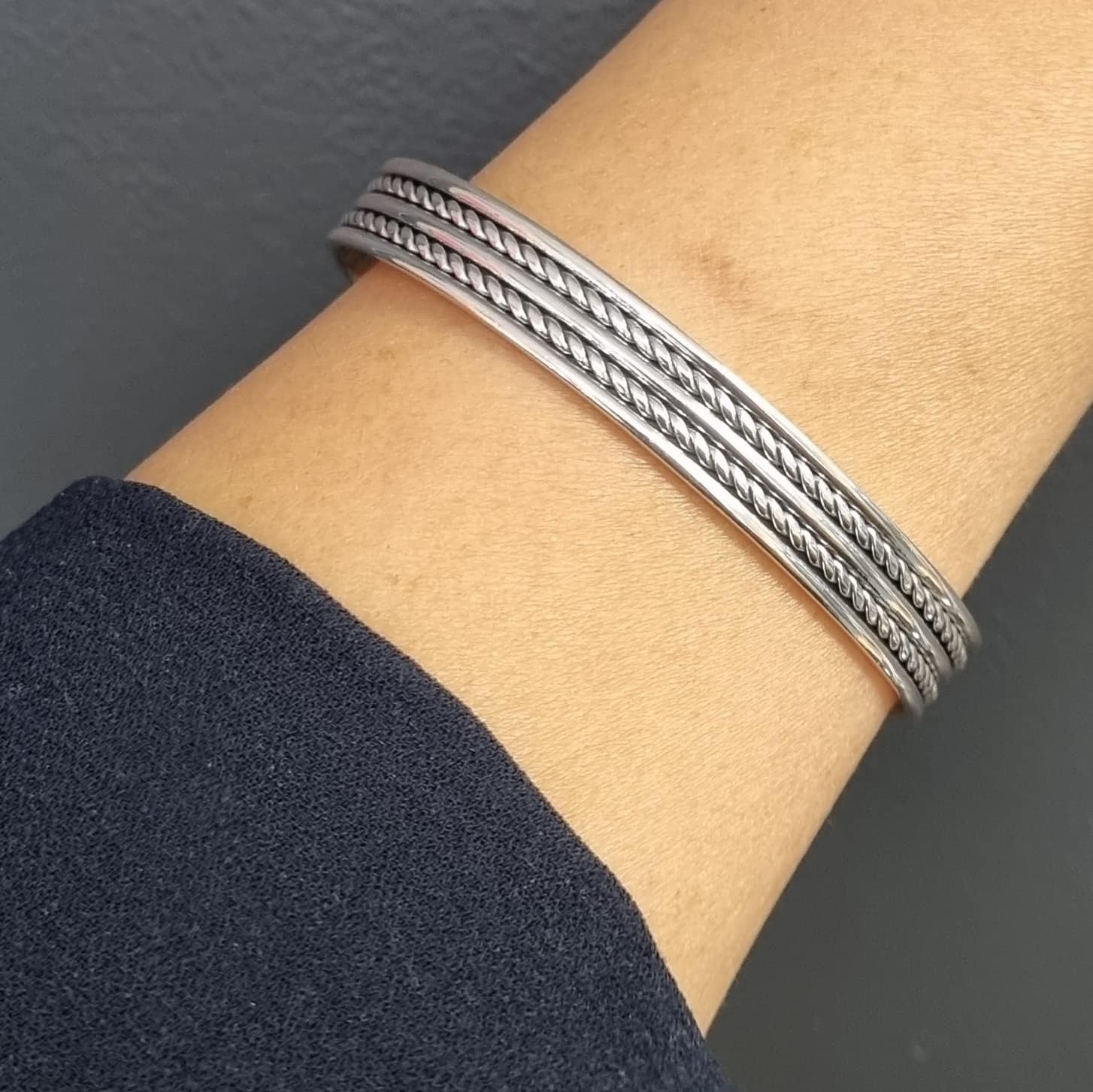 Braided design 925 sterling silver bangle on model