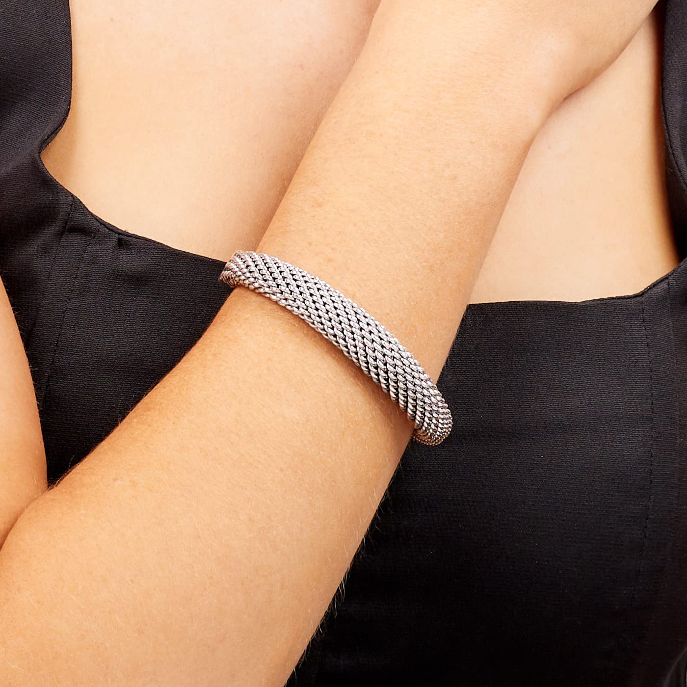 Braided details 925 sterling silver tapered bangle on female model